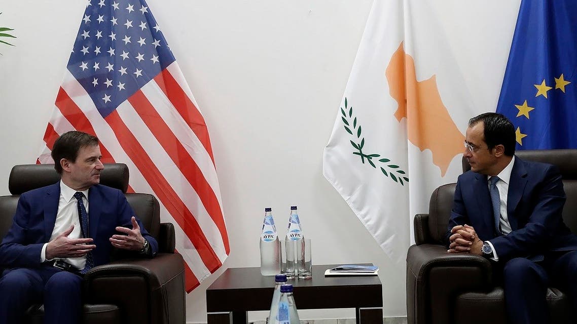 Cyprus' foreign minister Nikos Christodoulides, right, talks with Under Secretary of the United States of America, for Political Affairs, David Hale during their meeting at Larnaca international airport, Cyprus, Sunday, Aug. 16, 2020. (AP)