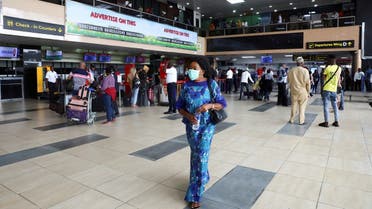 A woman wears a protective face mask due to the spread of the coronavirus disease (COVID-19), at the Murtala Mohammed International airport in Lagos, Nigeria March 19, 2020. (Reuters)