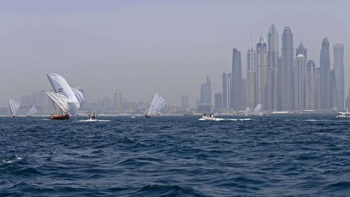 Dhows participate in the al-Gaffal traditional long-distance dhow sailing race near the finish line off of Dubai, on May 14, 2017, after starting from the Gulf island of Sir Bu Nair. (File photo: AFP)