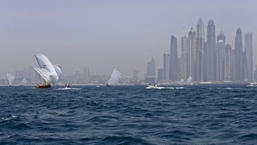 Dhows participate in the al-Gaffal traditional long-distance dhow sailing race near the finish line off of Dubai, on May 14, 2017, after starting from the Gulf island of Sir Bu Nair. (File photo: AFP)