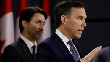 Canada's Minister of Finance Bill Morneau attends a news conference with Prime Minister Justin Trudeau in Ottawa, Ontario, Canada, March 11, 2020. (Reuters)