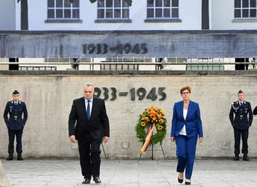 Germany’s Defense minister Annegret Kramp-Karrenbauer (R) and Jeremy Issacharoff, Ambassador of Israel in Germany (L), walk together after a wreath laying ceremony in the memorial place concentration camp Dachau near Munich, on August 18, 2020, on the occasion of military exercise. (AFP)