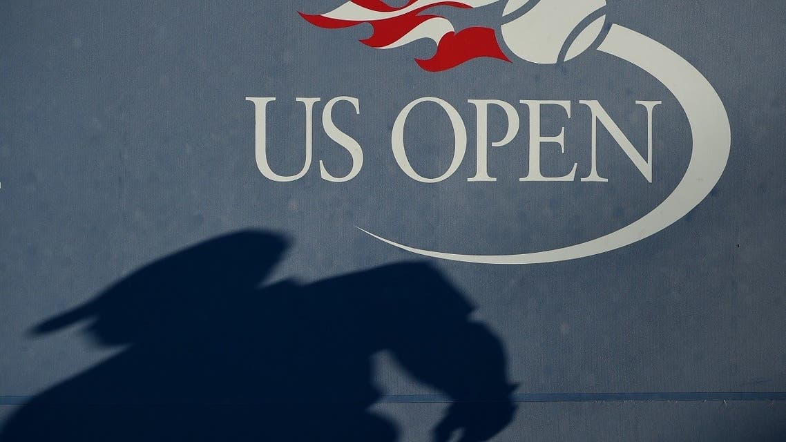 Shadow of an umpire is seen on the wall as Daniel Evans of the United Kingdom plays against Stan Wawrinka of Switzerland in their 2016 US Open men's single match. (AFP)