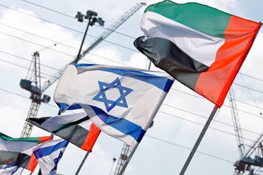 Israeli and United Arab Emirates flags line a road in the Israeli coastal city of Netanya, Israel on August 16, 2020. (AFP)