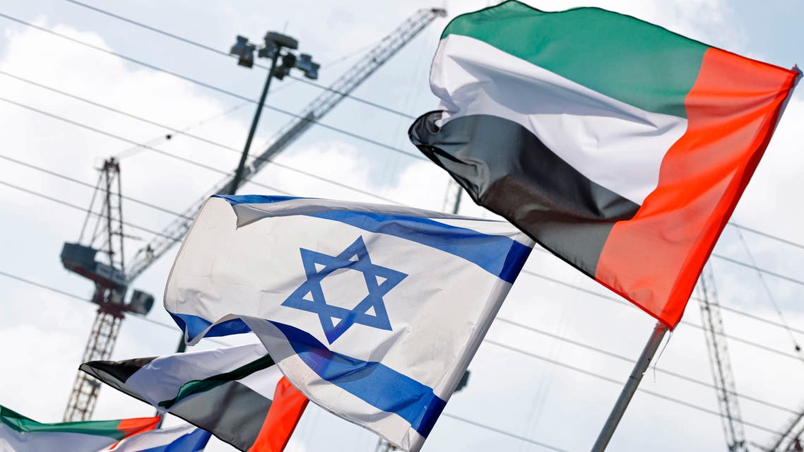 Israeli and United Arab Emirates flags line a road in the Israeli coastal city of Netanya, Israel on August 16, 2020. (AFP)