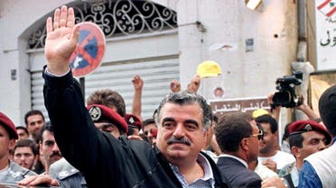 Former Lebanese Prime Minister Rafik Hariri waves to supporters after casting his vote at a Beirut polling station in Lebanon, Sept. 1, 1996. (File Photo: Reuters)
