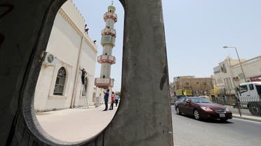 Workers install a security camera outside the Al A'ali Grand Mosque, where joint Sunni and Shi'ites prayers are to be held to show solidarity and co-existence between the two sects of Islam, ahead of Friday prayers in Al A'ali south of Manama, July 3, 2015. (Reuters)
