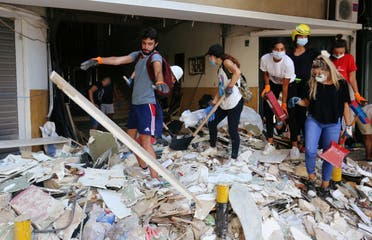Volunteers clean rubble from the streets following Tuesday's blast in Beirut's port area, in Beirut, Lebanon August 7, 2020. (Reuters)