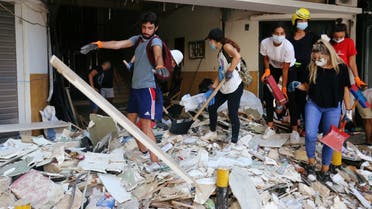 Volunteers clean rubble from the streets following Tuesday's blast in Beirut's port area, in Beirut, Lebanon August 7, 2020. (Reuters)