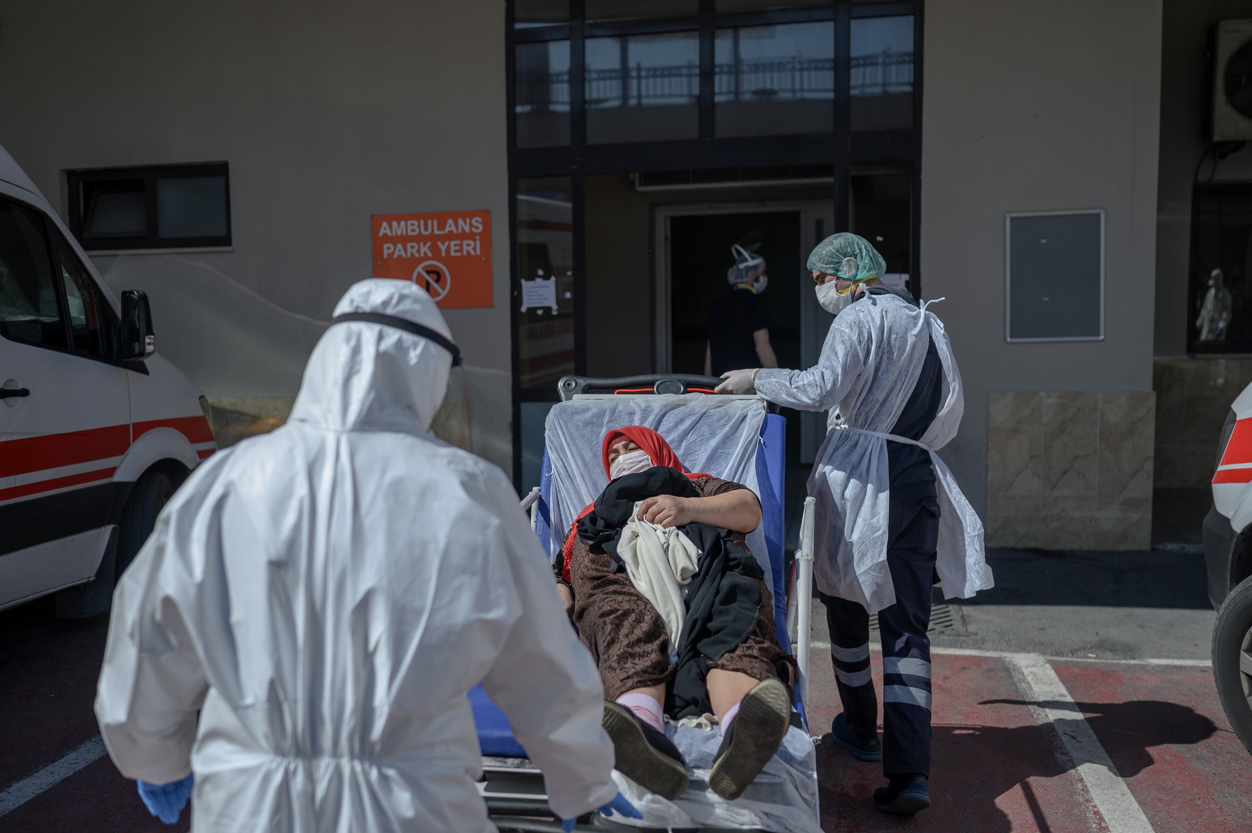 Health workers transport a patient supposed to be infected by the novel coronavirus Covid19 in front of Bagcilar public hospital in Istanbul, on April 28, 2019, in Istanbul. (AFP)