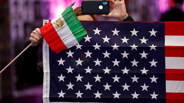 Attendees hold flags from Iran and the United States as Iranian Americans from across California converge in Los Angeles to participate in the California Convention for a Free Iran and to express support for nationwide protests in Iran from Los Angeles, California, U.S., January 11, 2020. (Reuters)