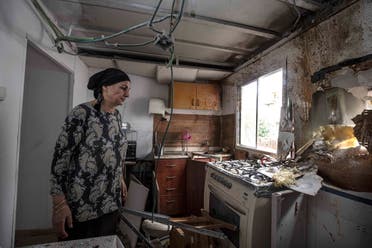 Homeowner Osnat Malka inspects damage from a rocket fired overnight by Palestinian militants from the Gaza Strip, in Sderot, Israel, Friday, Aug. 21, 2020. (AP)