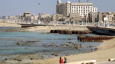 Libyans sit along the seaside promenade in the eastern Libyan port city of Benghazi on January 21, 2020. (AFP)