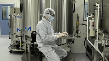 A scientist works at the mAbxience biosimilar monoclonal antibody laboratory plant in Garin, Buenos Aires province, on August 14, 2020, where an experimental coronavirus vaccine will be produced for Latin America. (AFP)