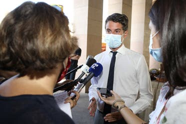 French Secretary of State and Government’s spokesperson Gabriel Attal (C) answers journalists’ questions at a market in Ajaccio, during a visit to the French Mediterranean island of Corsica on August 12, 2020. (AFP)