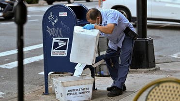 A United States Postal Service worker makes his rounds in Manhattan, Aug. 20, 2020. (AFP)