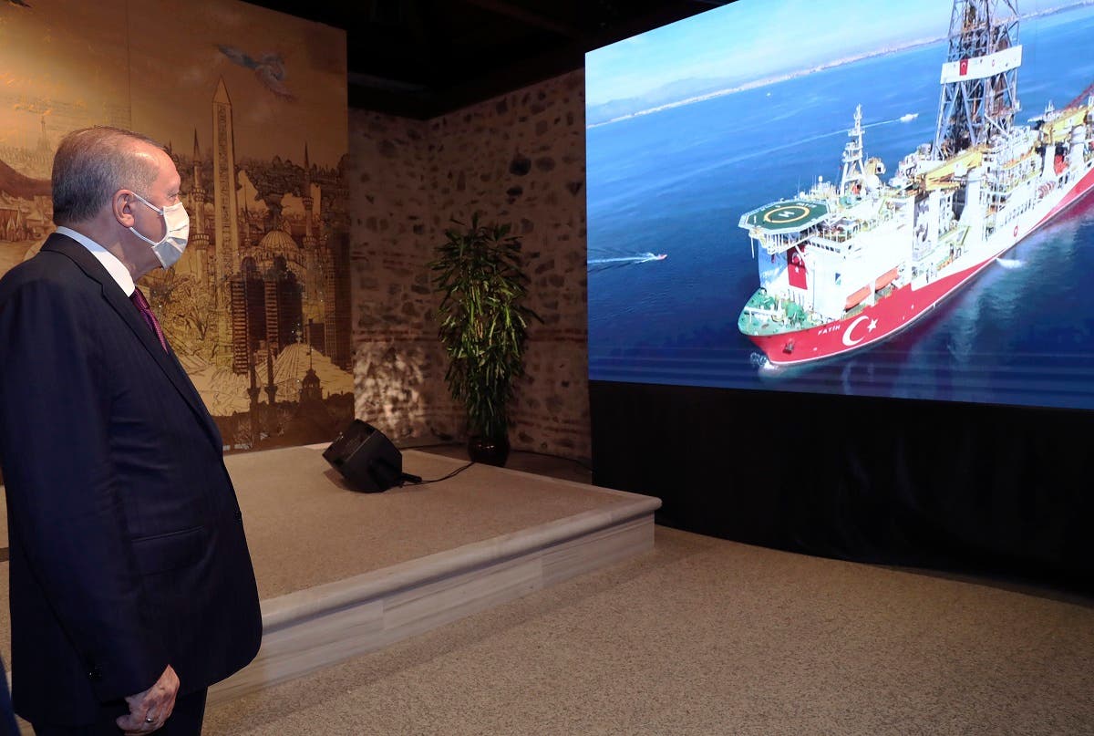 Turkey's President Recep Tayyip Erdogan watches Turkish drilling ship, Fatih, in the background, as he speaks in Istanbul, August 21, 2020. (AP)