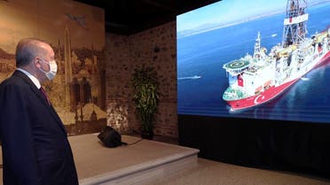 Turkey's President Recep Tayyip Erdogan watches Turkish drilling ship, Fatih, in the background, as he speaks in Istanbul, August 21, 2020. (AP)
