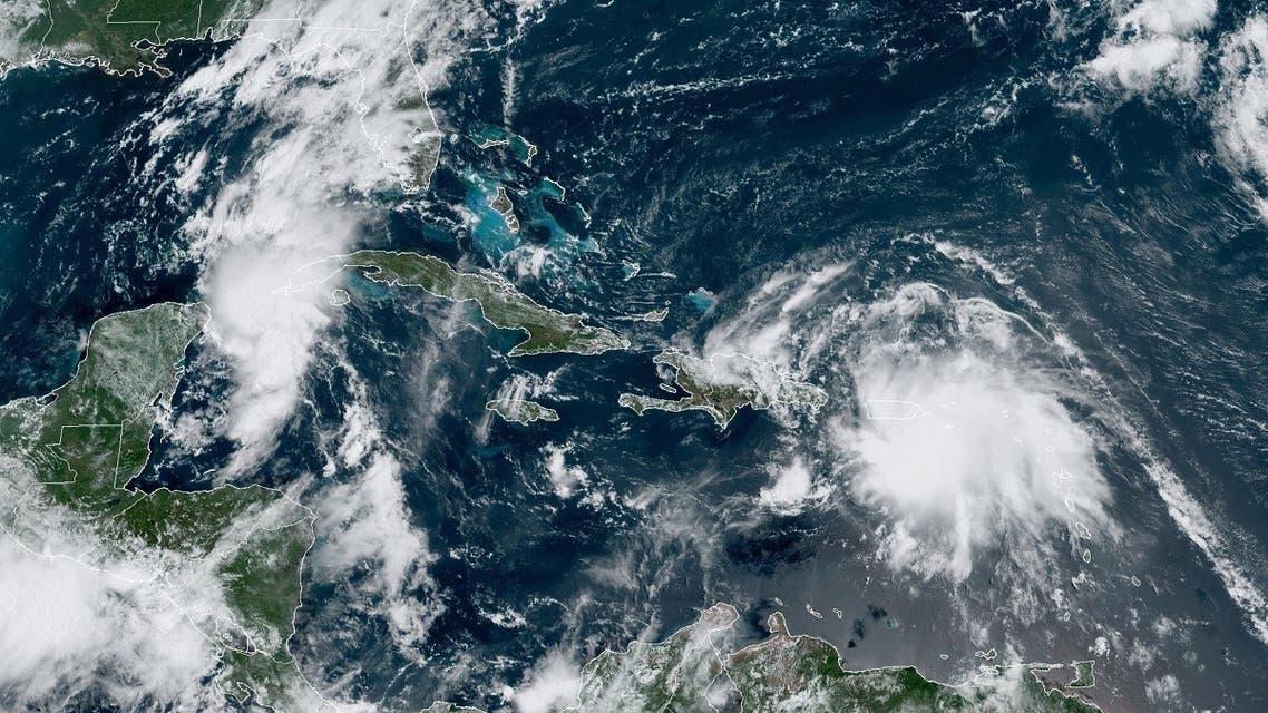 Image obtained from the National Oceanic and Atmospheric Administration (NOAA) shows Tropical Storm Laura over Puerto Rico and approaching Haiti. (AFP)