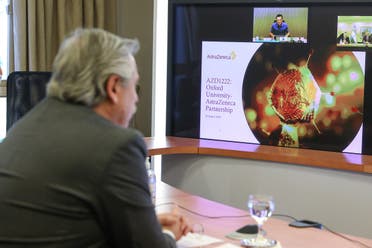 Argentina's President Alberto Fernandez attends a video conference with AstraZeneca's Chief Executive Officer Pascal Soriot, at the Olivos Presidential Residence, in Buenos Aires. (Reuters)