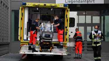 Paramedics load a stretcher into an ambulance that allegedly transported Russian opposition leader Alexei Navalny at Charite Mitte Hospital Complex where he will receive medical treatment in Berlin, Germany August 22, 2020. REUTERS/Christian Mang