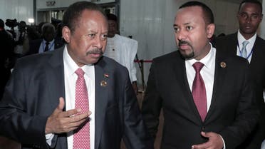 Sudan’s PM Abdalla Hamdok and Ethiopia’s PM Abiy Ahmed arrive together to attend a meeting of the African Union (AU) in Addis Ababa, Ethiopia, February 9, 2020. (Reuters/Tiksa Negeri)
