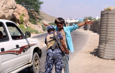 A member of the Yemeni security forces frisks a man at a checkpoint in the former Al-Qaeda in the Arabian Peninsula (AQAP) jihadist's bastion of Mukalla in Yemen's coastal southern Hadramawt province, on November 30, 2018. (AFP)