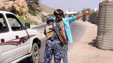 A member of the Yemeni security forces frisks a man at a checkpoint in the former Al-Qaeda in the Arabian Peninsula (AQAP) jihadist's bastion of Mukalla in Yemen's coastal southern Hadramawt province, on November 30, 2018. (AFP)
