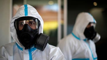 Members of the Emergency Army Unit wearing protective suits to protect from coronavirus prepare to disinfect a hospital in Madrid, Spain, Spain on April 30, 2020. (AP)