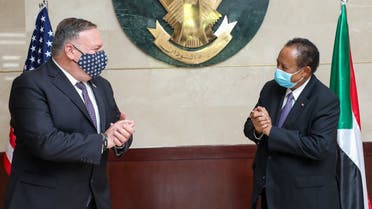 US Secretary of State Mike Pompeo (L) greeting Sudanese Prime Minister Abdalla Hamdok (R) in Khartoum. (AFP)