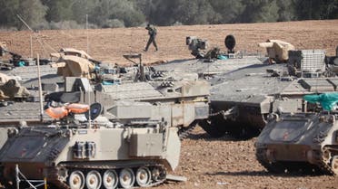 An Israeli soldier walks past military vehicles in a gathering point near the Israel-Gaza Border, Thursday, Nov. 14, 2019. (File photo: AP)
