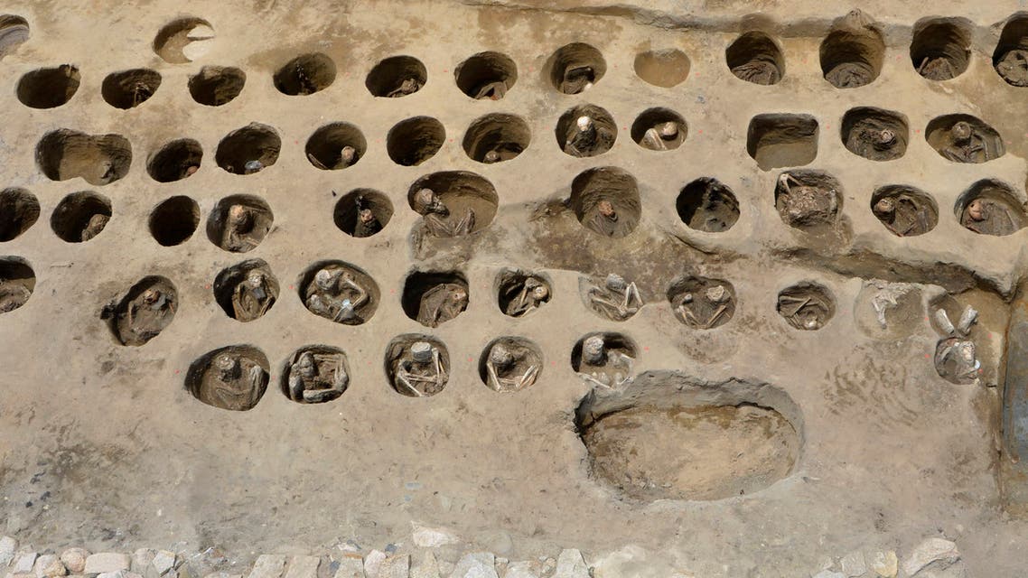 This undated photo provided Wednesday, Aug. 26, 2020, by Osaka City Cultural Properties Association shows human bones buried in holes at the south section of the Umeda Grave burial site, in Osaka, western Japan. (AP)