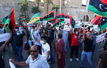 Libyans chant slogans during a demonstration due to poor public services at the Martyrs' Square at the centre of the GNA-held Libyan capital Tripoli on August 25, 2020. (AFP)