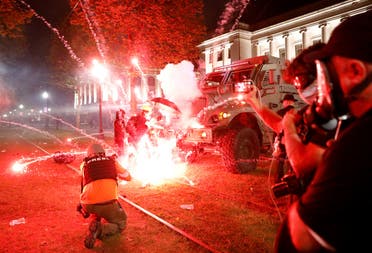 Flares go off in front of a Kenosha Country Sheriff Vehicle as demonstrators take part in a protest following the police shooting of Jacob Blake, a Black man, in Kenosha, Wisconsin, U.S. August 25, 2020. (Reuters)