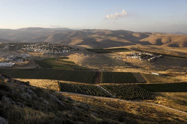 A picture shows the Israeli settlements of Mitzpe Kramim (R) and Kokhav HaShahar (l) in the occupied West Bank on June 18, 2020. (AFP)