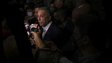 Iraqi Prime Minister Mustafa al-Kadhimi, center, speaks to journalists during his visit to Basra, Iraq, Saturday, Aug. 22, 2020. (AP Photo/Nabil al-Jurani)