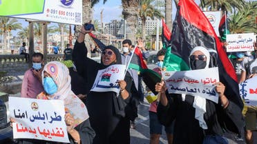 Libyans chant slogans during a demonstration due to poor public services at the Martyrs' Square at the centre of the GNA-held Libyan capital Tripoli on August 25, 2020. (AFP)
