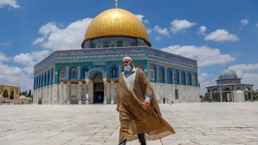 A Palestinian man walks outside the Dome of the Rock Mosque in Jerusalem's al-Aqsa compound on July 9, 2020. (AFP)
