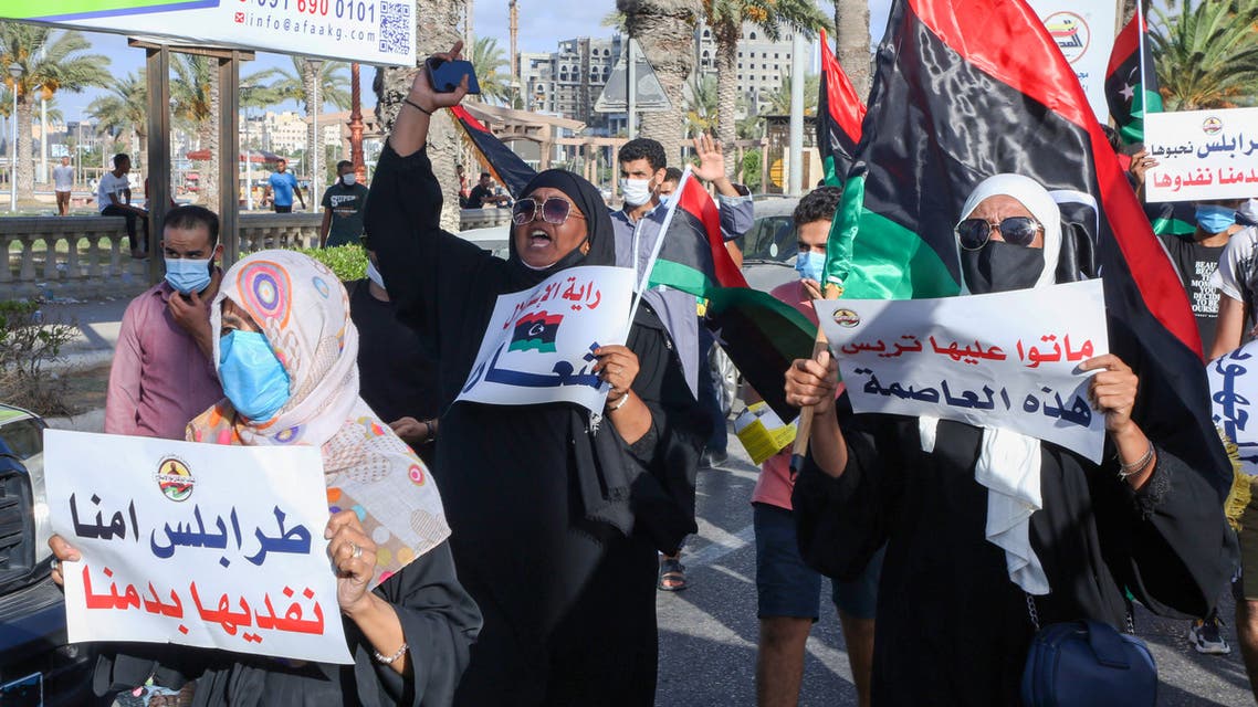 Libyans chant slogans during a demonstration due to poor public services at the Martyrs' Square at the centre of the GNA-held Libyan capital Tripoli on August 25, 2020. Angered by chronic water, power, and petrol shortages in a country with Africa's largest proven crude oil reserves, the mostly young people had marched through the city centre chanting slogans including No to corruption!