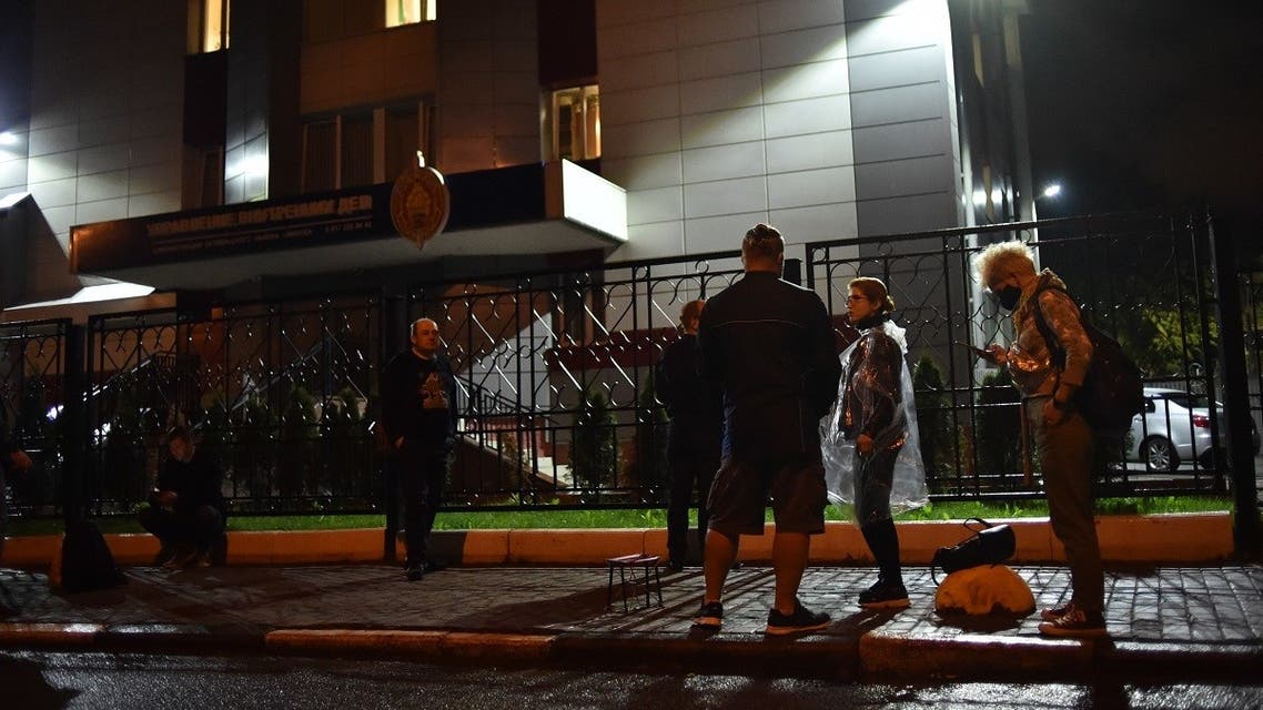 Relatives and colleagues of journalists detained during a rally to protest against disputed presidential elections results wait in front of the district department of internal affairs in Minsk on August 27, 2020. (AFP)