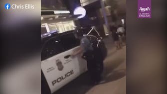 Watch: Minneapolis police officer struck on the neck with garbage can lid during riot