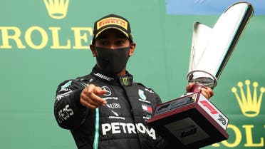 Mercedes’ Lewis Hamilton celebrates with the trophy on the podium after winning the race Formula One F1 - Belgian Grand Prix , at Spa-Francorchamps, in Belgium, on August 30, 2020. (Reuters)