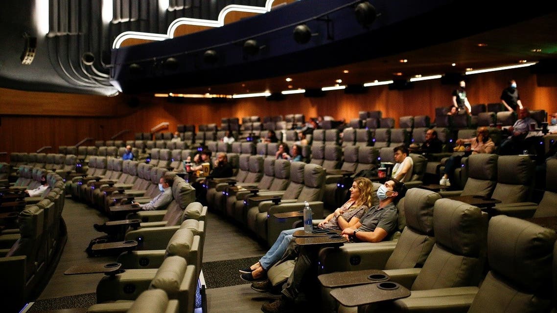 People take their seats inside the Odeon Luxe Leicester Square cinema, on the opening day of the film Tenet, amid the coronavirus disease (COVID-19) outbreak, in London, Britain, August 26, 2020. (Reuters)
