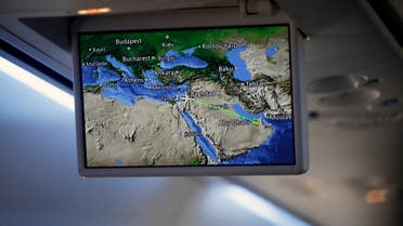An overhead screen displays a map showing the flight route of an El Al plane from Israel en route to Abu Dhabi, United Arab Emirates, August 31, 2020. (AP)