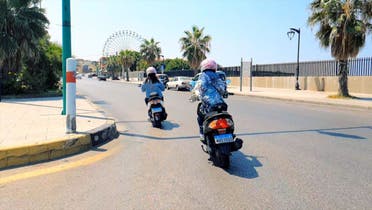 Rana and Carine Karazi, who have launched a women-only motorbike taxi service, are seen driving in Beirut, Lebanon. (Supplied)