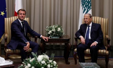 Lebanese President Michel Aoun welcomes French President Emmanuel Macron at Beirut International airport, Lebanon, on August 31, 2020. (Reuters)