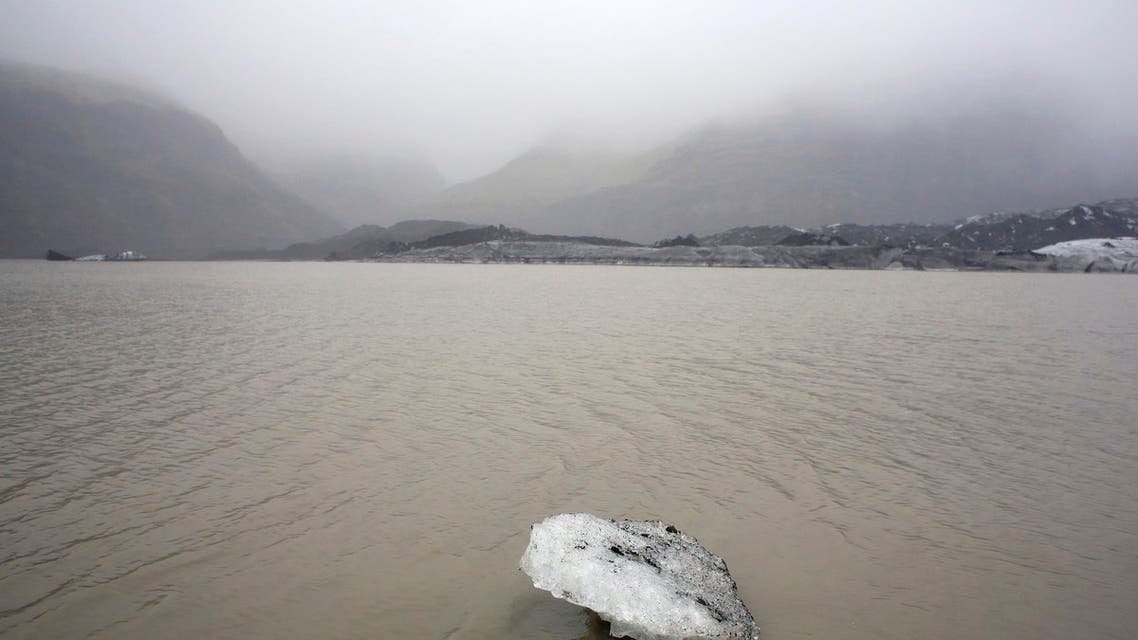 A view shows an ice flow floating on a lake in front of the Solheimajokull Glacier, where the ice has receded by more than 1 kilometer (0.6 miles) since annual measurements began in 1931, Iceland October 16, 2015. The French President went to the glacier to experience firsthand the damage caused by global warming, ahead of major U.N. talks on climate change in Paris this year. France is host to the World Climate Change Conference 2015 (COP21) from November 30 to December 11. Picture taken October 16, 2015. REUTERS/Thibault Camus/Pool