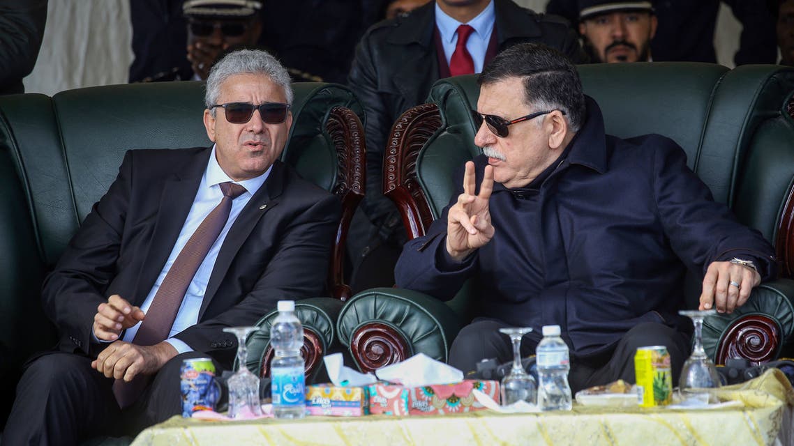 Libya's unity government Prime Minister Fayez al-Sarraj (R) speaks with Interior Minister Fathi Bashagha (L) during a graduation ceremony for a new coastguard cadets in the port of Tripoli on January 3, 2019.