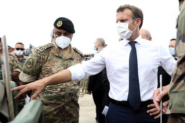 French President Emmanuel Macron meets members of the military mobilised for the reconstruction of the port of Beirut, in Beirut, Lebanon September 1, 2020. (Stephane Lemouton/Pool via Reuters)