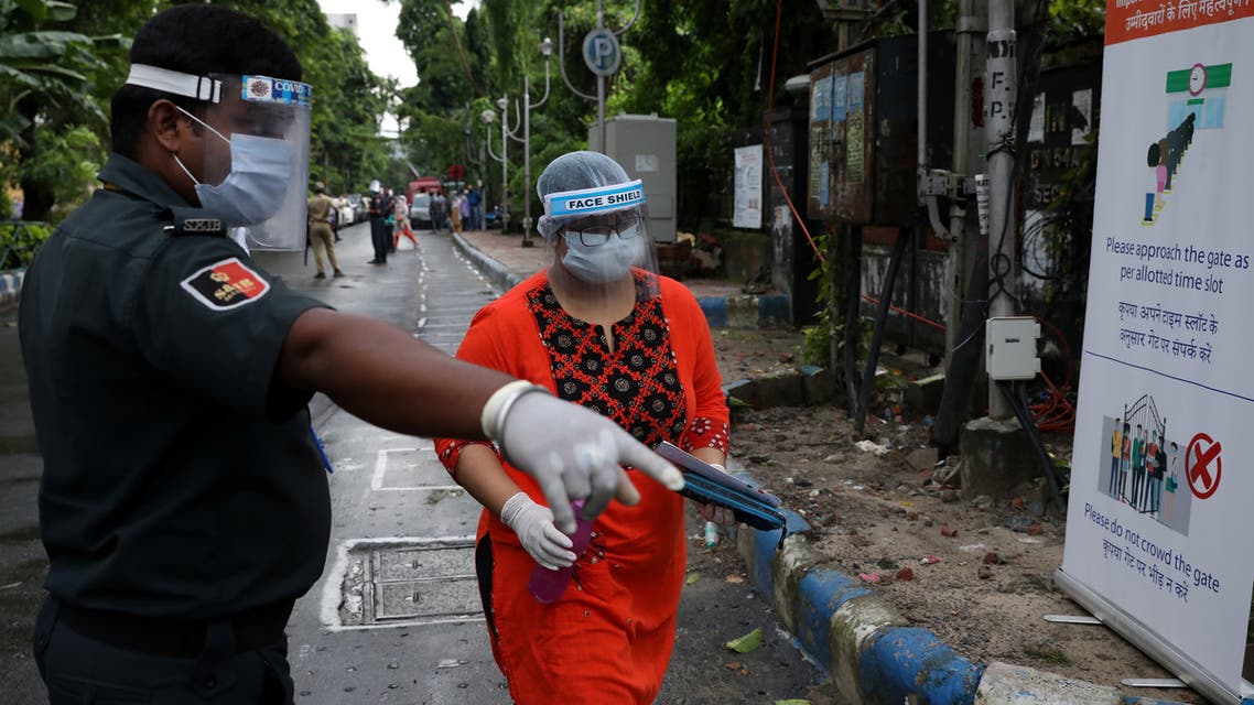A student wearing a protective face mask and face shield arrives at an examination centre for Joint Entrance Examination (JEE), amidst the spread of the coronavirus disease (COVID-19), in Kolkata, India, September 1, 2020. REUTERS/Rupak De Chowdhuri